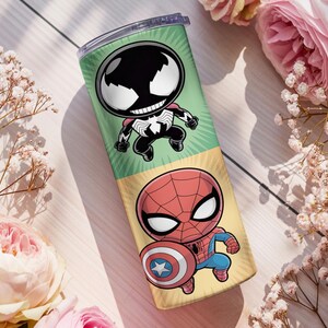 May include: A tall, insulated tumbler featuring cartoon illustrations of Venom and Spider-Man. The tumbler has a green and yellow background with the characters in a chibi style. The tumbler is cylindrical and has a silver lid.