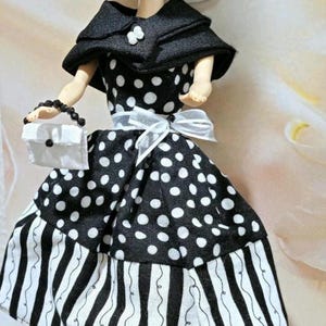 barbie black white dress and Color:Bright Royal Most appropriate for a Empire Barbie dolls Colors and decorations may