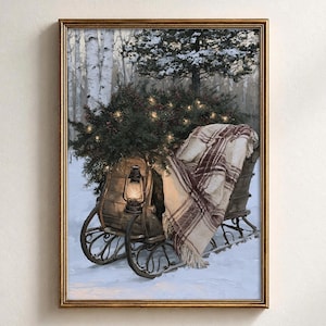 May include: A framed wall art print depicting a vintage wooden sleigh in a snowy forest. The sleigh is filled with evergreen branches adorned with warm fairy lights, a lit lantern, and a cream-coloured blanket with a dark red plaid pattern.