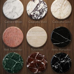 May include: A set of three ceramic mugs with a speckled, matte finish. The mugs are in shades of cream, light gray, and dark gray. Each mug has a simple, minimalist design and a rounded handle. Perfect for coffee or tea.