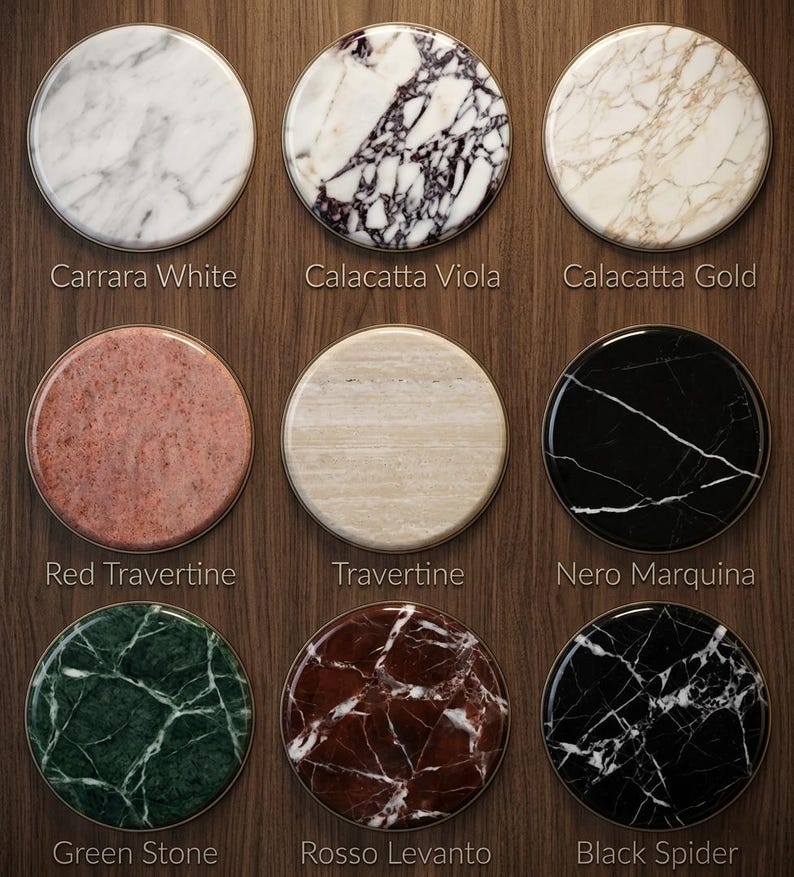 May include: A set of three ceramic mugs with a speckled, matte finish. The mugs are in shades of cream, light gray, and dark gray. Each mug has a simple, minimalist design and a rounded handle. Perfect for coffee or tea.