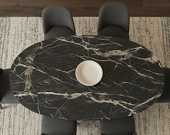 Mesa de comedor ovalada de mármol negro con pedestal de piedra moderno
