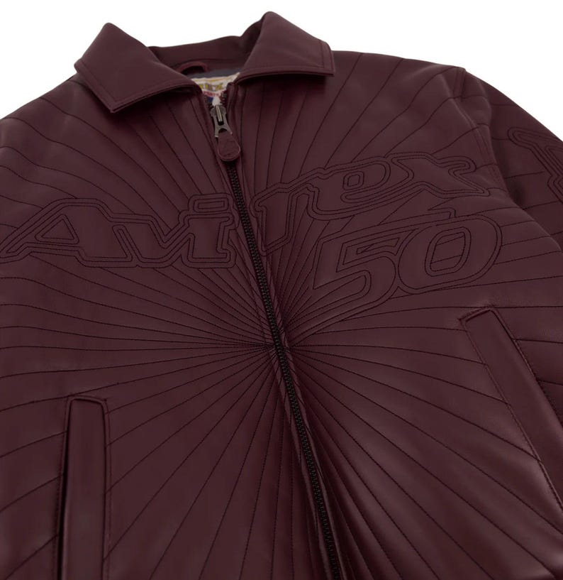 May include: A set of three ceramic mugs with a speckled, matte finish. The mugs are in shades of cream, light gray, and dark gray. Each mug has a simple, minimalist design and a rounded handle.