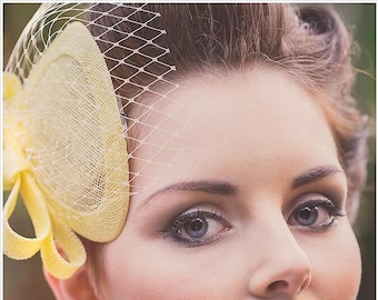 Yellow vintage inspired fascinator with veiling