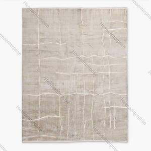 May include: A rectangular rug in a neutral colour, with a textured surface. It has a grid-like pattern of white lines, creating a modern, abstract design. The rug's colour palette is primarily beige and off-white.