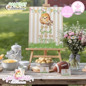 May include: A wooden easel holds a sign with a cartoon potato and the words "Grab a Spud and Pile on the Toppings." The image features a football, bowls of food, and flowers, suggesting a party or gathering.