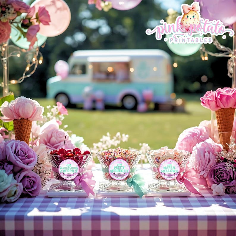 May include: A festive outdoor scene with an ice cream truck in the background. Three glass bowls filled with cherries, sprinkles, and marshmallows sit on a checkered tablecloth. Each bowl has a decorative label. Pink and purple flowers and balloons add to the party atmosphere.