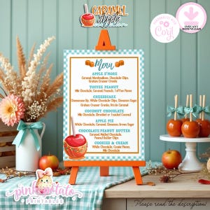 May include: A menu board for a caramel apple collection, listing various caramel apple flavours. The menu is on a white background with an orange border, displayed on a small orange easel. The image includes caramel apples and decorative elements.