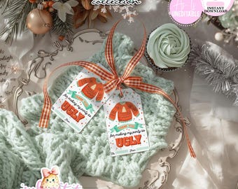 May include: Two gift tags with orange sweater illustrations and the text "THANK YOU for making my party so UGLY" tied with a red and white ribbon. The tags rest on a light green knitted fabric, with a cupcake and decorative elements.