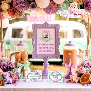 May include: A party table decorated with flowers, drink dispensers, and a purple framed sign. The sign says "pour the bubbly add some juice top with fruit". There are also signs that say "Strawberries" and "Orange Juice".
