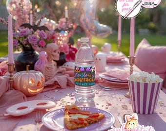 May include: A pink Halloween party table setting with a water bottle featuring a custom label, a slice of pizza, and a popcorn container. Decorations include a pumpkin, candles, and floral arrangements.