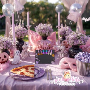 May include: A Halloween table setting with pink and purple decorations. Features a slice of pizza, a black chalkboard sign with Halloween graphics, floral arrangements, and decorative skeletons. The table is set with plates, forks, and a mask.