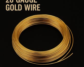 May include: A coil of 28 gauge gold wire against a black background. The wire is tightly wound, with a bright, metallic sheen. The text "28 GAUGE GOLD WIRE" is displayed in a gold color at the top of the image.