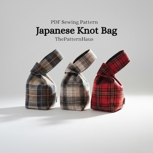 May include: Three Japanese Knot Bags in a row, each with a unique plaid pattern. The bags are in shades of blue, gray, and red. The text "Japanese Knot Bag" is displayed above the bags.