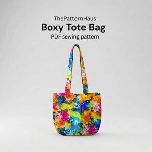 May include: A boxy tote bag with a vibrant floral pattern in shades of pink, orange, yellow, and blue. The bag has long handles and the text "Boxy Tote Bag" and "PDF sewing pattern" is visible.