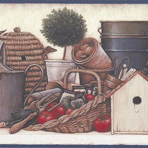 May include: A decorative border featuring gardening tools and elements. A woven basket holds red tomatoes and seed packets. Other items include a metal bucket, a beehive-shaped basket, a birdhouse, and a stack of metal containers. A butterfly rests on a plant.