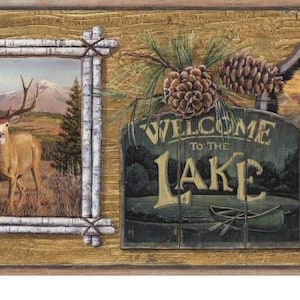 May include: Rustic-themed wall border featuring framed landscape paintings of a deer and a moose, with a sign that reads "Welcome to the Lake." The border includes autumn leaves and pinecones, evoking a natural, outdoorsy aesthetic.