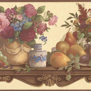 May include: A decorative wallpaper border featuring a still life with flowers and fruit. The image includes pink and red roses, grapes, pears, and plums. A gold vase and a blue and white vase are also present.