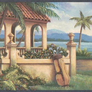 May include: A scenic painting of a golf course with a Mediterranean-style structure. The structure has arched openings and a red tile roof. A golf bag with clubs rests against a wall, with palm trees and a body of water in the background.