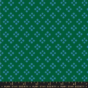 May include: Green fabric with a repeating pattern of four light blue dots arranged in a square. The fabric has a ruler along the bottom edge with the text "RUBY STAR SOCIETY".