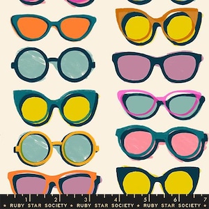 May include: A pattern of colorful sunglasses in various shapes and styles. The sunglasses feature bold colors like orange, yellow, teal, and pink, with black outlines. The background is a light beige color. The text "RUBY STAR SOCIETY" is at the bottom.
