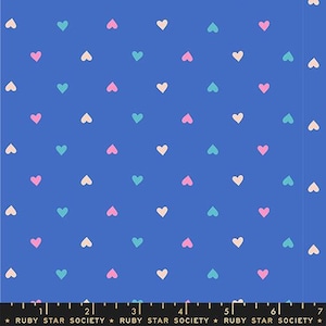 May include: Blue fabric with a repeating pattern of small hearts in pink, teal, and cream colors. The hearts are evenly spaced across the fabric. The text "RUBY STAR SOCIETY" is at the bottom.