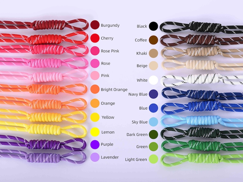 May include: A collection of colorful cords in various shades, including burgundy, cherry, and black. Each cord has a loop at the end and is paired with a color swatch and a corresponding name. The image showcases a range of colors for crafting or accessories.