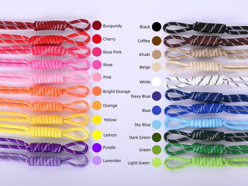 May include: A collection of colorful cords in various shades, including burgundy, cherry, and black. Each cord is looped at the end and labeled with its corresponding color name. The image showcases a range of hues, from bright orange to light green.