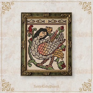 May include: Cross-stitch picture in a gold-coloured frame, depicting a mythical bird with a woman's face. The bird has a white, yellow, and pink body, with green and red floral details. The frame is ornate. The text "NobleLadyPupsik" is at the bottom.