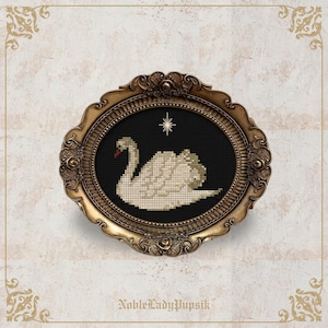 May include: A cross-stitch swan design in a gold oval frame. The swan is white with a red beak, set against a black background with a star. The frame has ornate detailing and the text "NobleLadyPupsik" is at the bottom.