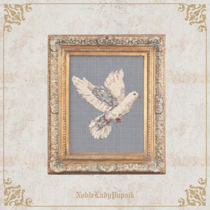 May include: A framed cross-stitch of a white dove with outstretched wings, accented with gray and blue details. The artwork is set against a gray background within a gold ornate frame. The text "NobleLadyPupsik" is at the bottom.