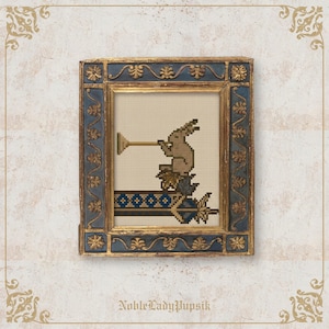 May include: Cross-stitch artwork in a gold and blue ornate frame. The artwork depicts a brown rabbit playing a trumpet, with blue and gold leaf accents. The frame has a gold inner border and a blue outer border with gold floral details. The text "NobleLadyPupsik" is at the bottom.