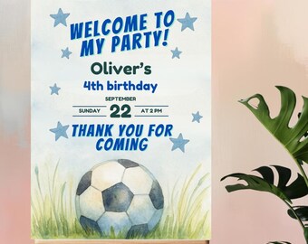 May include: A welcome sign on an easel for a birthday party. The sign reads "WELCOME TO MY PARTY!" and "THANK YOU FOR COMING." It includes the text "Oliver's 4th birthday, September 22 at 2 PM" with a soccer ball graphic.