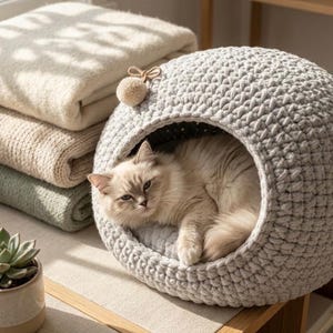 May include: A white ceramic mug with a black handle and the text "But First, Coffee" in a black, bold font. The mug is on a white surface.