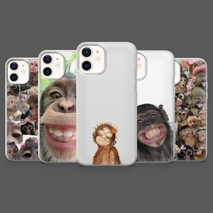 May include: A collection of phone cases featuring various monkey designs. The cases display images of monkey faces, close-ups, and illustrations. The cases are white and clear, showcasing the colorful monkey artwork. The cases are designed for a smartphone.
