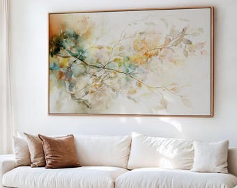 Puede incluir: Una gran pintura de acuarela enmarcada con un delicado diseño botánico. La obra de arte presenta colores suaves y apagados, incluyendo verdes, amarillos y naranjas, con un enfoque en ramas y hojas. La pintura se exhibe sobre un sofá blanco.