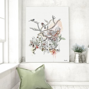 Canvas print featuring a detailed watercolor and ink illustration of a deer surrounded by floral elements and birds. The artwork is predominantly in shades of gray, black, and beige, with accents of orange and pink. The deer is centrally positioned, with its antlers extending outward. The style is whimsical and nature-inspired. The artist's signature is subtly placed in the bottom right corner.