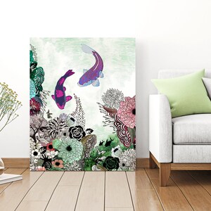 A digital art print featuring two purple and pink koi fish swimming in a green and white floral design. The print is framed and hanging on a white wall.