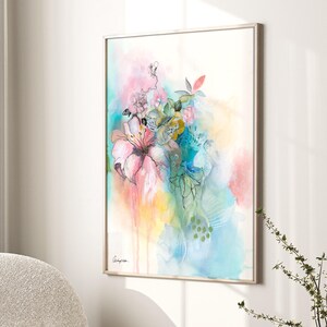 A framed watercolor painting of a bouquet of flowers in shades of pink, blue, green, and yellow. The flowers are painted in a loose, abstract style, and the background is a soft wash of color.