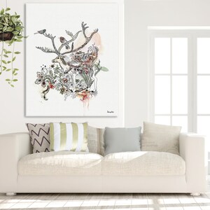 Canvas print featuring a watercolor and ink illustration of a reindeer surrounded by floral elements and birds. The artwork is predominantly in shades of black, gray, and muted pinks and greens, set against a white background. The reindeer is intricately detailed, with its antlers spreading across the top of the canvas. The overall style is whimsical and nature-inspired. The artwork is titled 'Hemlock' in a small, elegant font in the bottom right corner.