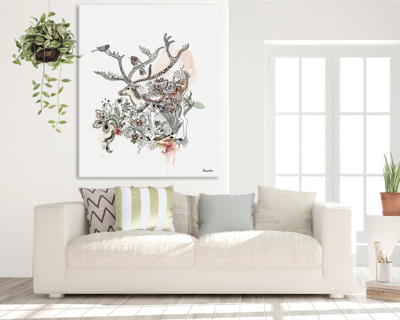 Canvas print featuring a watercolor and ink illustration of a reindeer surrounded by floral elements and birds. The artwork is predominantly in shades of black, gray, and muted pinks and greens, set against a white background. The reindeer is intricately detailed, with its antlers spreading across the top of the canvas. The overall style is whimsical and nature-inspired. The artwork is titled 'Hemlock' in a small, elegant font in the bottom right corner.