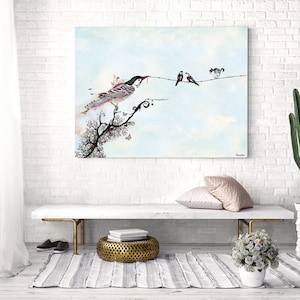 May include: A watercolor painting of a bird perched on a branch with pink blossoms. Two smaller birds and a cat are on a wire above the bird. The background is a light blue sky with clouds.