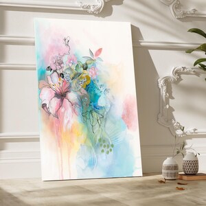 Abstract watercolor painting of pink, blue, green, and yellow flowers with a white background.