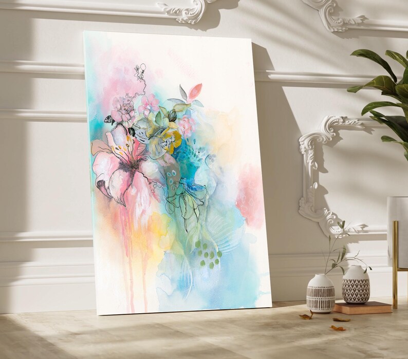 Abstract watercolor painting of pink, blue, green, and yellow flowers with a white background.