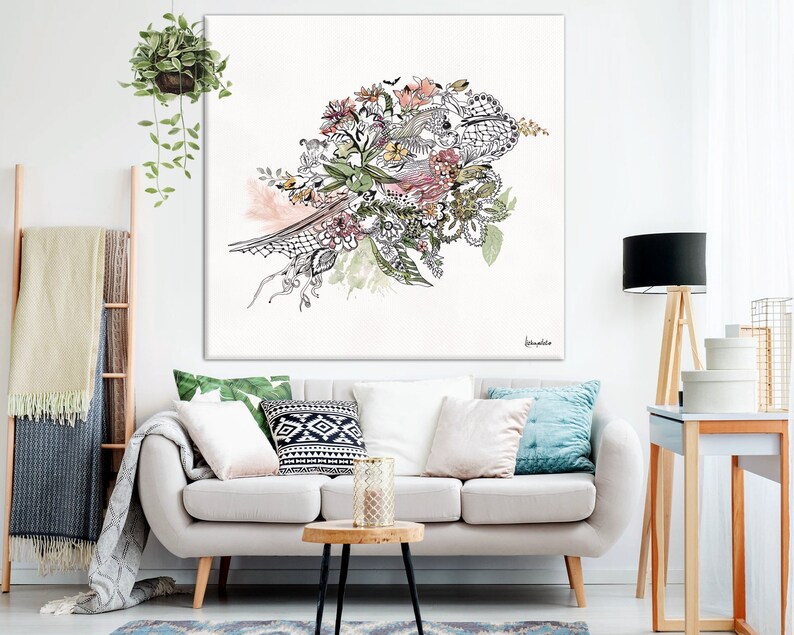 May include: A white canvas print with a black and white illustration of a floral bouquet with pink, green, and yellow accents. The bouquet is in the shape of a bird with its wings spread out.