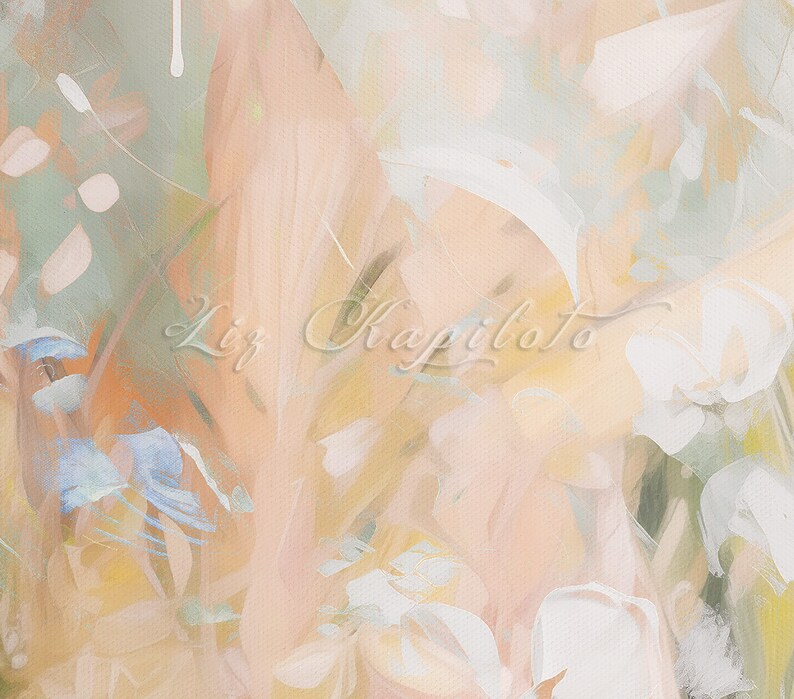 Abstract painting with a soft, muted color palette. The painting features shades of peach, green, white, and yellow. The artist's signature, 'Liz Kapiloto', is visible in the center of the painting.