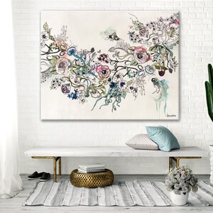 May include: Large floral art print featuring a watercolor and ink design with roses, vines, and abstract elements in pink, blue, and purple hues. The artwork is displayed on a white brick wall above a bench with a gold metal base.