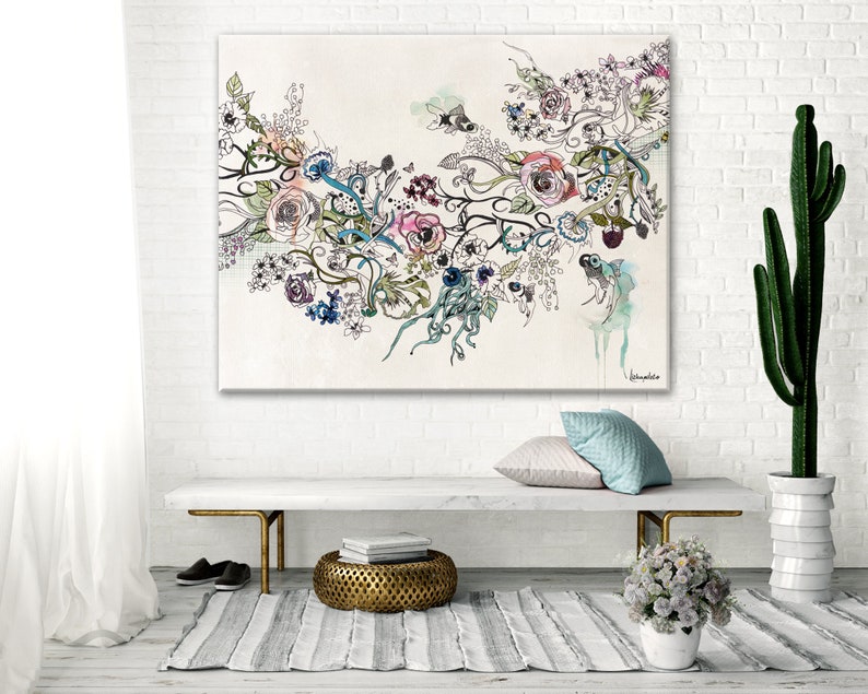 May include: Large floral art print featuring a watercolor and ink design with roses, vines, and abstract elements in pink, blue, and purple hues. The artwork is displayed on a white brick wall above a bench with a gold metal base.