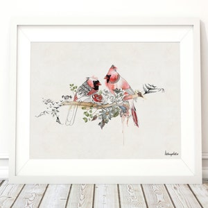 watercolor painting of two red cardinals perched on a branch with a rose. The birds are facing each other and the painting has a delicate, romantic feel.