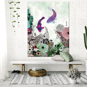 A white canvas print with a green, pink, and purple floral design. Two purple and pink fish are swimming in the water. The print is hanging on a white brick wall above a white bench. There are two green plants on the floor, one in a white pot and the other in a brown pot.